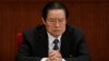 FILE - Zhou Yongkang, then Chinese Communist Party Politburo Standing Committee member in charge of security, attends a plenary session of the National People's Congress at the Great Hall of the People in Beijing, China. 