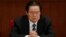 FILE - Zhou Yongkang, then Chinese Communist Party Politburo Standing Committee member in charge of security, attends a plenary session of the National People's Congress at the Great Hall of the People in Beijing, China. 