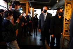 Vice President Kamala Harris and her husband Doug Emhoff arrive at Maria Empanada, in Denver, March 16, 2021.