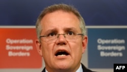 Menteri Imigrasi Australia Scott Morrison dalam sebuah jumpa pers di Sydney pada September 2013. (AFP/William West)