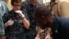 Medical professionals aboard the Military Sealift Command hospital ship USNS Comfort (T-AH 20) treat a six-year-old Haitian