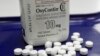 FILE - OxyContin pills, an opioid drug, are seen at a pharmacy in Montpelier, Vermont, Feb. 19, 2013. Americans, even though they comprise only five percent of the world's population, consume 80 percent of the its supply of pain medications.
