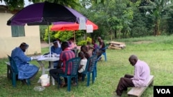 Members of Kirembo village are prepared for the Ebola trial vaccination in Kasese district, Uganda, June 16, 2019. (H. Athumani for VOA)