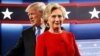 Republican U.S. presidential nominee Donald Trump and Democratic U.S. presidential nominee Hillary Clinton take the stage for their first debate in Hempstead, New York, Sept. 26, 2016. 