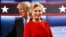 Republican U.S. presidential nominee Donald Trump and Democratic U.S. presidential nominee Hillary Clinton take the stage for their first debate in Hempstead, New York, Sept. 26, 2016. 