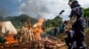 Ivory carvings and elephant tusks are lit on fire by firefighters for the first Cameroon ivory burn, attended by U.S. Ambassador to the United Nations Samantha Power at the Palais des Congres in Yaounde, Cameroon on April 19, 2016, to highlight the need to halt the Ivory trade in order to save Africa's elephants.