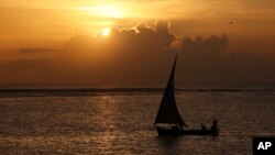 FILE - Kenyan fishermen sail of for a day of fishing in a dhow in Malindi. The U.S. has lifted travel bans to much of the coast, from the town of Malindi down to areas near the border with Tanzania.