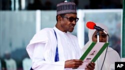 FILE - Nigerian President Muhammadu Buhari is sworn in for a second four-year term in Abuja, May 29, 2019.