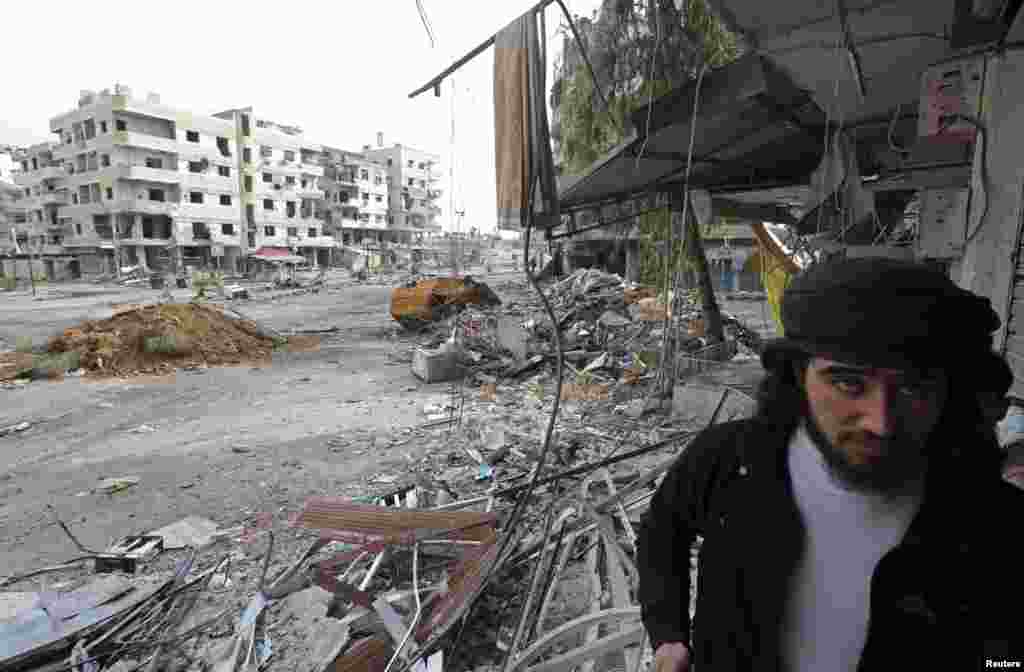 A Free Syrian Army fighter walks in the Haresta neighborhood of Damascus Feb. 7, 2013. 