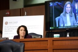 Sen. Amy Klobuchar questions Supreme Court nominee Amy Coney Barrett during the third day of her confirmation hearings before the Senate Judiciary Committee on Capitol Hill in Washington, Oct. 14, 2020.