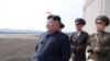 FILE - North Korean leader Kim Jong Un, accompanied by military officials, observes a Korean People's Air Force training flight at undisclosed location in this April 16, 2019, photo released April 17, 2019 by North Korea's Central News Agency (KCNA).