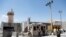 Afghan soldiers stand guard at the gate of Bagram Airfield, on the day the last of the American troops vacated it, Parwan province, Afghanistan, July 2, 2021.