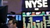 FILE - Traders work on the floor at the New York Stock Exchange in New York, July 8, 2015.