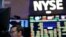 FILE - Traders work on the floor at the New York Stock Exchange in New York, July 8, 2015.