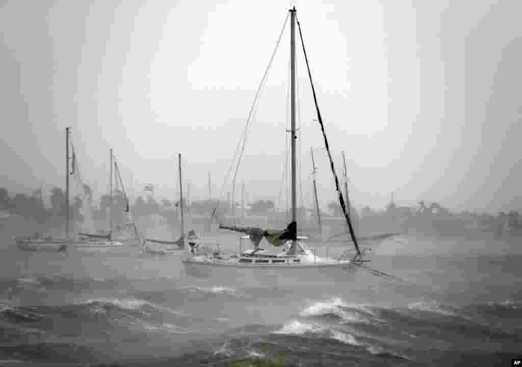 Sailboats moored near Watson Island ride out the winds and waves as Hurricane Irma passes by in Miami Beach, Florida, Sept. 10, 2017.
