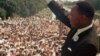 Martin Luther King Jr. acknowledges the crowd at the Lincoln Memorial for his "I Have a Dream" speech during the March on Washington, August 28, 1963. 