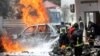 Somali firefighters try to extinguish flames at the scene of a car bomb in Mogadishu, Jan. 29. Al-Shabab and the Islamic State are battling in the country's mountainous northeast. 