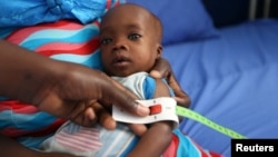 FILE - A muac tape used to screen malnutrition in children at the stabilization ward in Molai General Hospital Maiduguri, Nigeria Nov. 30, 2016. 