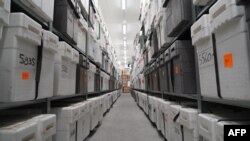 Insulated boxes containing ice core samples lay on shelves in the University of Copenhagen’s ice core repository in Copenhagen, Denmark, on Oct. 26, 2023.