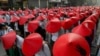 Anti-coup school teachers in their uniform and traditional Myanmar-hats participate in a demonstration in Mandalay, Myanmar, Wednesday, March 3, 2021. Demonstrators in Myanmar took to the streets again on Wednesday to protest last month's seizure of…