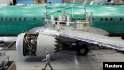 FILE - A worker walks past Boeing's new 737 MAX-9 under construction at their production facility in Renton, Washington on February 13, 2017. (REUTERS/Jason Redmond/File Photo)