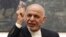 FILE - Afghan President Ashraf Ghani speaks during a press conference at the presidential palace in Kabul, Afghanistan, July 15, 2018. 