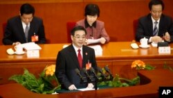 A woman paints earthen lamps which are used to decorate temples and homes during Diwali, the Hindu festival of lights, in Kolkata.
