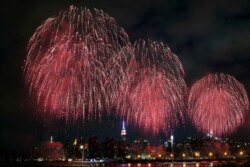 FILE - Fireworks explode over the East River in front of the Manhattan skyline as seen from the Brooklyn borough of New York during the Macy's Fourth of July fireworks show.