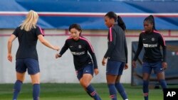 FILE - (L-R) PSG's Andrine Hegerberg, Shuang Wang, Grace Geyoro and Aminata Diallo warm up prior to their Women's Champions League soccer match between Paris-Saint-Germain and Sankt Polten at Jean Bouin stadium in Paris, France, Sept. 27, 2018. 