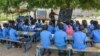 FILE - A teacher conducts his class under a tree in Moho, a village in the Northern Province of Cameroon, Sept. 16, 2016. In parts of Cameroon, teacher are on strike.