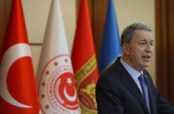 FILE - Turkey's Defense Minister Hulusi Akar speaks to a group of reporters in Ankara, Turkey, May 21, 2019.