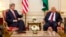 US Secretary of State John Kerry (l) meets with Palestinian President Mahmoud Abbas in Paris, Feb. 19, 2014.
