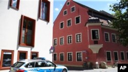 A police car stands guard in front of the house of deceased cleric Georg Ratzinger in Regensburg, Germany, July 1, 2020. The Rev. Georg Ratzinger, the older brother of Emeritus Pope Benedict XVI has died at age 96.