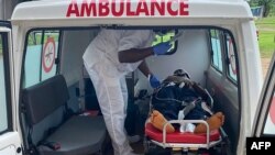 FILE - A handout photo from Medecins Sans Frontieres (Doctors Without Borders) on Oct. 25, 2020, shows a medic treating a victim of a shooting at a bilingual school in Kumba, Cameroon.