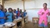 FILE - Teneng Sidonie Weteck sings and dances in class at a school for displaced Nigerian children at the Minawao camp, northern Cameroon, February 18, 2015.