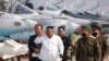FILE - In this undated file photo provided by the North Korean government on April 12, 2020, North Korean leader Kim Jong Un inspects an air defense unit in western area, North Korea. 