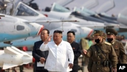 FILE - In this undated file photo provided by the North Korean government on April 12, 2020, North Korean leader Kim Jong Un inspects an air defense unit in western area, North Korea. 