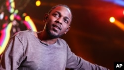 FILE - Kendrick Lamar performs on stage at Power 106's 'Cali Christmas' 2015 held at The Forum in Inglewood, California, Dec., 4, 2015.