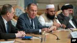 FILE - Russian Foreign Minister Sergey Lavrov, second left, speaks as he attends a conference on Afghanistan bringing together representatives of Afghan authorities and the Taliban in Moscow, Russia, Nov. 9, 2018. 