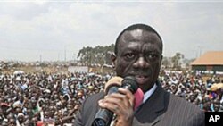 Uganda's opposition leader Kizza Besigye speaks during a rally at Rubaga division in the capital Kampala, Uganda, February 14, 2011