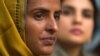 Pakistani gang rape victim Mukhtar Mai, left, addresses a news conference with lawmaker and Executive Director of Parliamentarian Human Rights Commission Kashmala Tariq in Islamabad, Pakistan on March 17, 2005. 