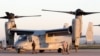FILE - U.S. Marine officers work next to an MV-22 Osprey VTOL aircraft at the Sigonella airbase, Sicily, March 24, 2011. The Pentagon is looking for a new generation of such planes.