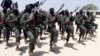 FILE - Hundreds of newly trained al-Shabab fighters perform military exercises in the Lafofe area, south of Mogadishu, Somalia, Feb. 17, 2017. 