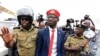 Ugandan musician turned politician, Robert Kyagulanyi also known as Bobi Wine is detained by policemen in Kasangati town, Wakiso district, Uganda, Jan. 6, 2020. 