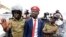 Ugandan musician turned politician, Robert Kyagulanyi also known as Bobi Wine is detained by policemen in Kasangati town, Wakiso district, Uganda, Jan. 6, 2020. 