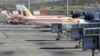 Planes of Spanish airline Iberia are parked at the Madrid's Barajas airport, at the start of a series of one-day strike by Iberia pilots, April 9, 2012.