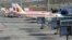 Planes of Spanish airline Iberia are parked at the Madrid's Barajas airport, at the start of a series of one-day strike by Iberia pilots, April 9, 2012.