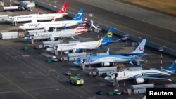FILE - An aerial photo shows several Boeing 737 MAX airplanes grounded at Boeing Field in Seattle, Washington, March 21, 2019. 