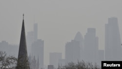 FILE PHOTO: City of London financial district is seen from Primrose Hill as high air pollution obscures the skyline over London