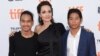 Maddox Jolie-Pitt, from left, Angelina Jolie and Pax Jolie-Pitt attend a premiere for "First They Killed My Father" on day 5 of the Toronto International Film Festival at the Princess of Wales Theatre, Sept. 11, 2017, in Toronto.